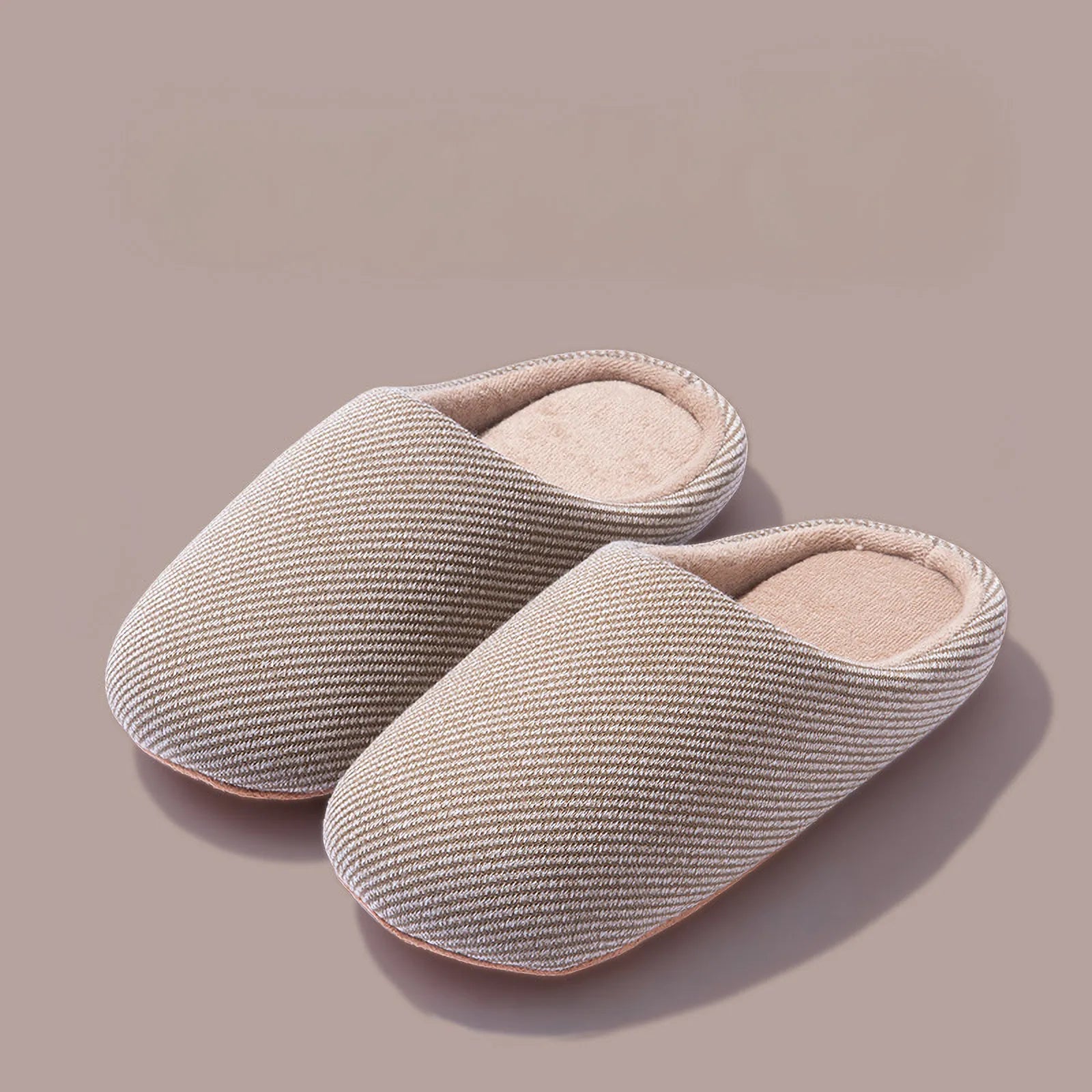 Pair of beige ribbed cotton house slippers isolated roomden