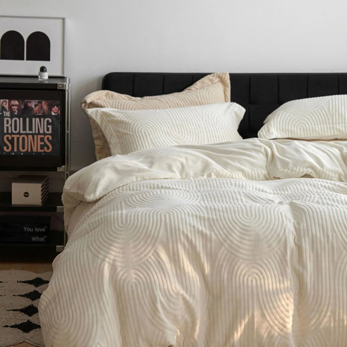 Another angle of the cream white flannel fleece bedding set, highlighting its soft drape and texture in natural light. - RoomDen