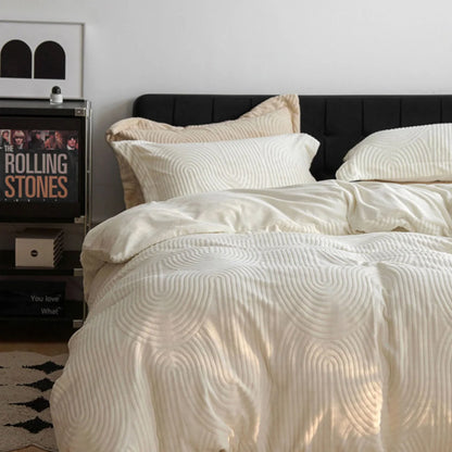 Another angle of the cream white flannel fleece bedding set, highlighting its soft drape and texture in natural light. - RoomDen
