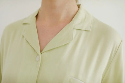 Collar detail of Sage Green pajama top with white piping