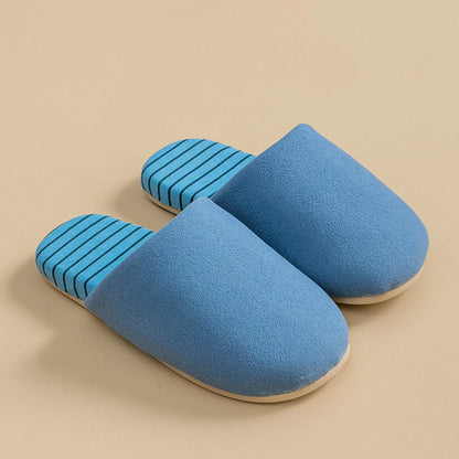Side view of blue cotton house slipper with striped insole and soft upper