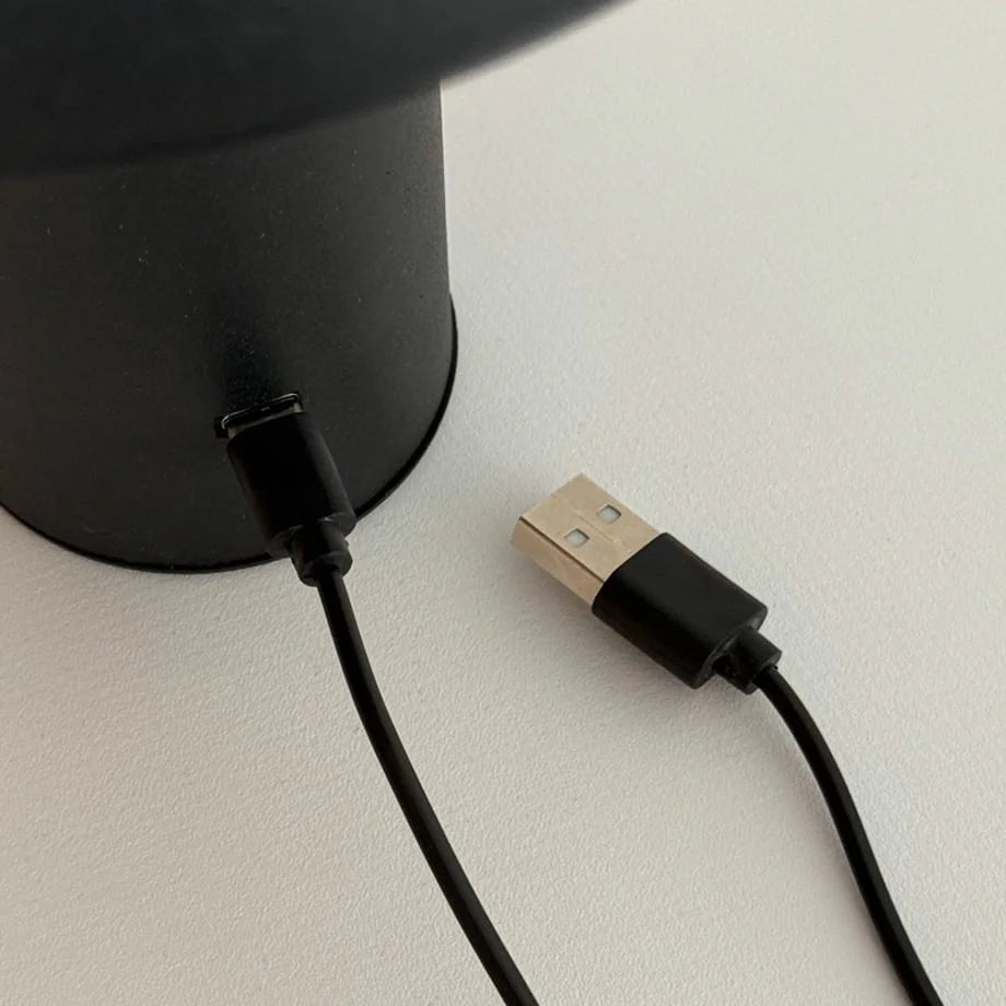 Detail shot of the Type-C charging port on the base of the black mushroom lamp - RoomDen.