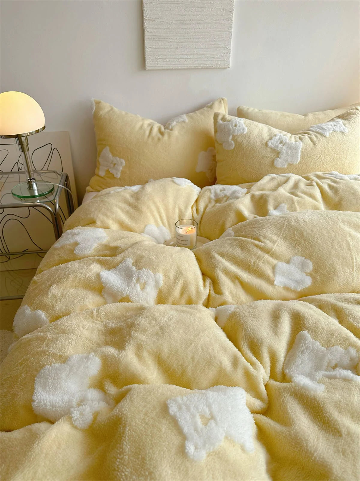 Detailed shot of the fluffy texture of the yellow flannel fleece duvet cover with white teddy bear appliqués. - RoomDen