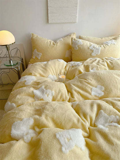 Detailed shot of the fluffy texture of the yellow flannel fleece duvet cover with white teddy bear appliqués. - RoomDen