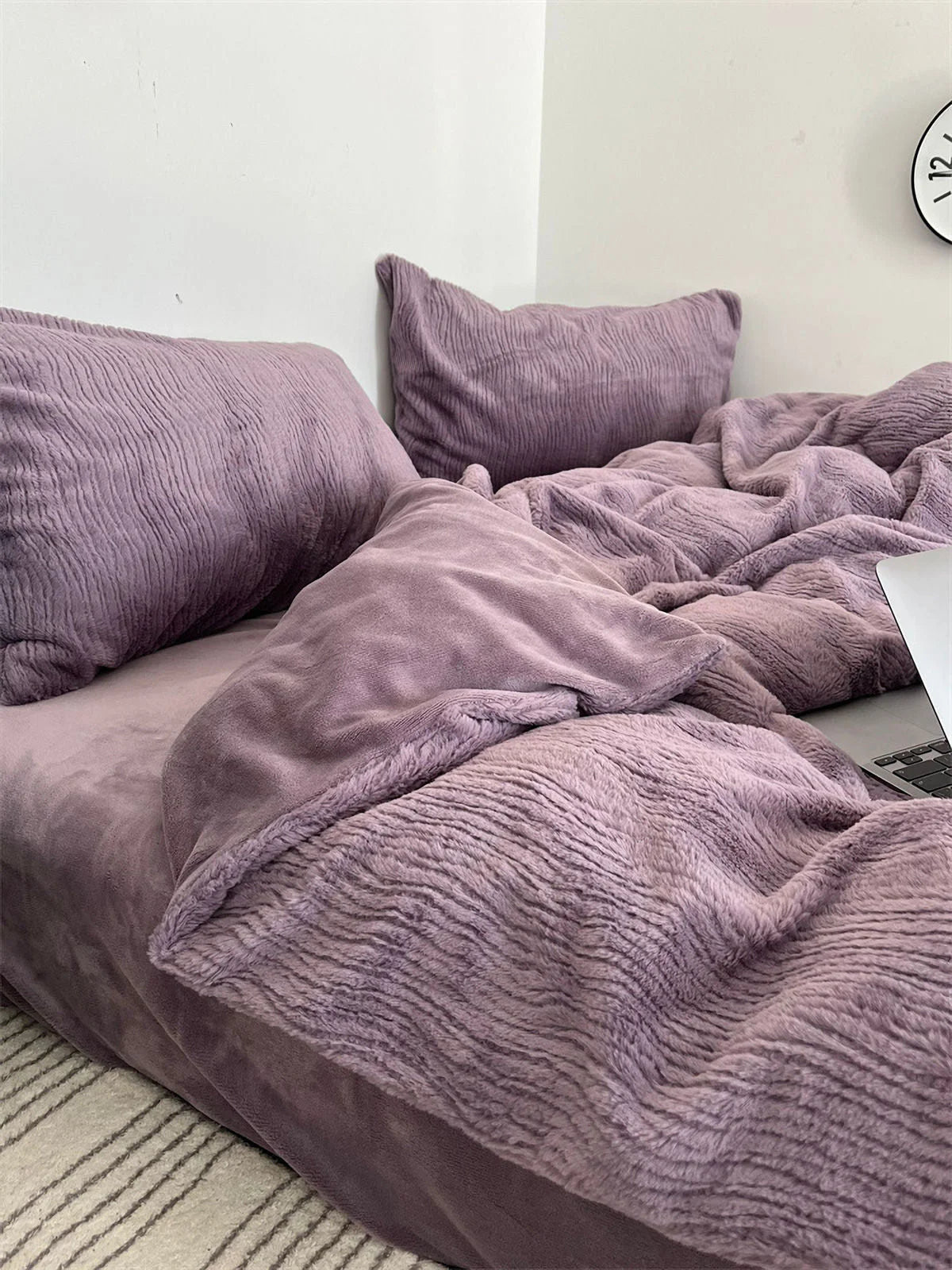 Close-up on the soft, wavy texture of a Dusty Lavender flannel fleece duvet cover and pillowcase. - RoomDen