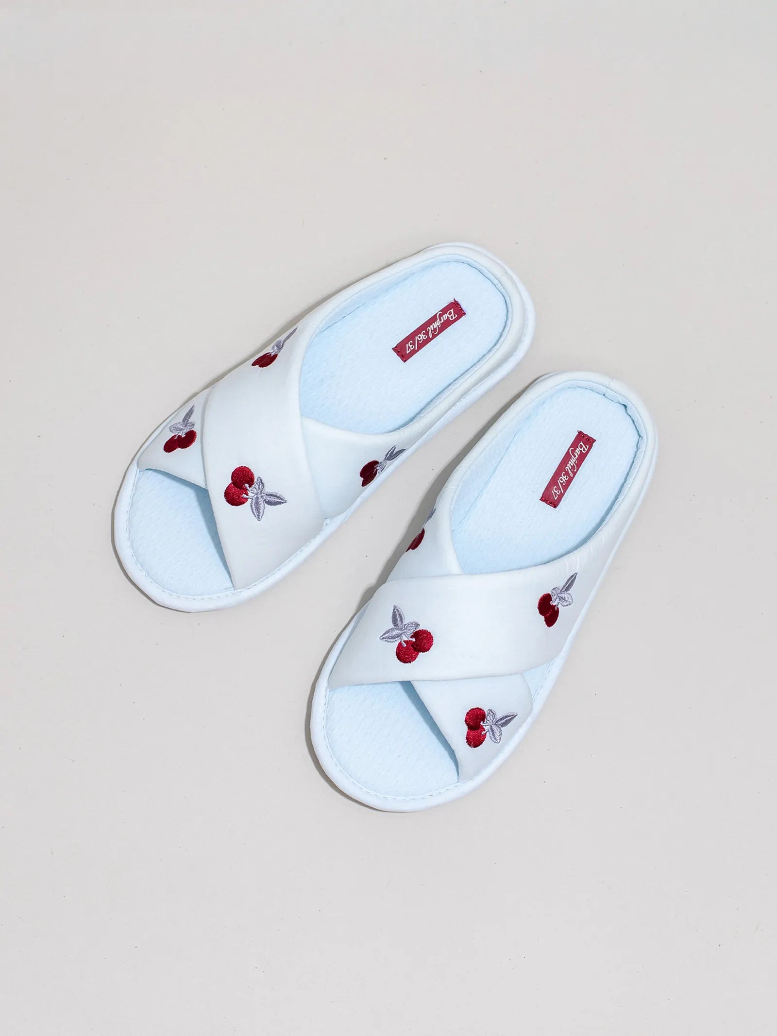 Top view of white cross-band slides with red cherry embroidery - RoomDen