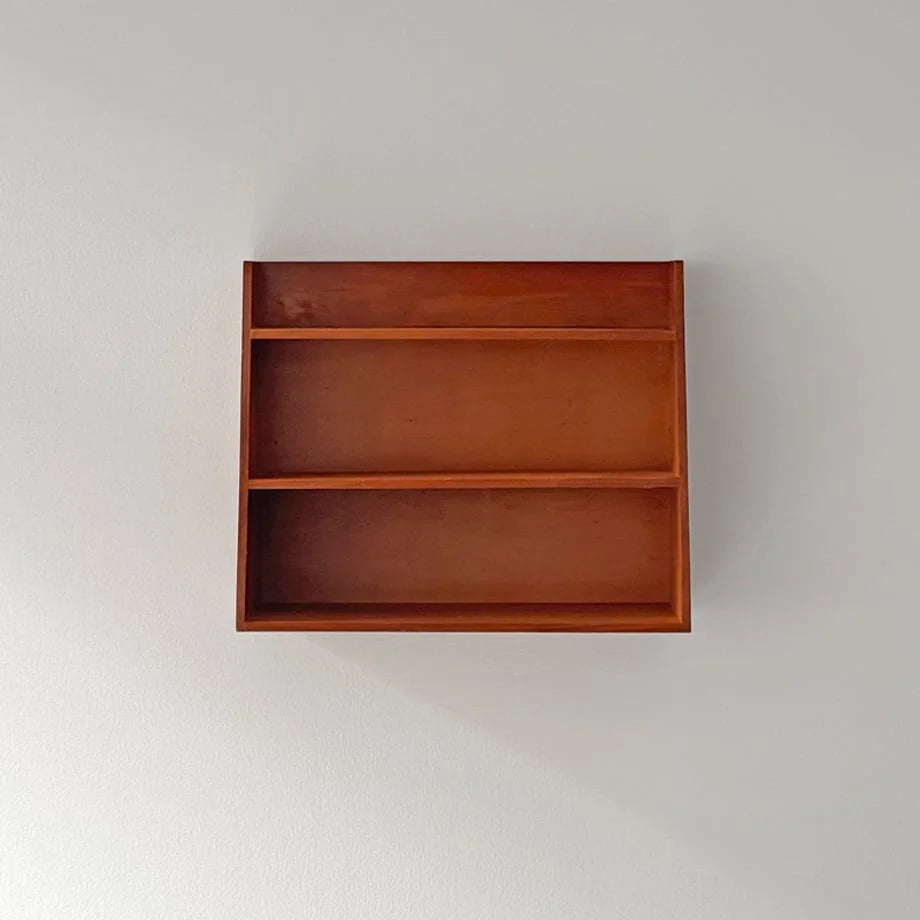 Straight-on studio shot of the empty Slanted Wood Wall Shelf against a white wall - RoomDen