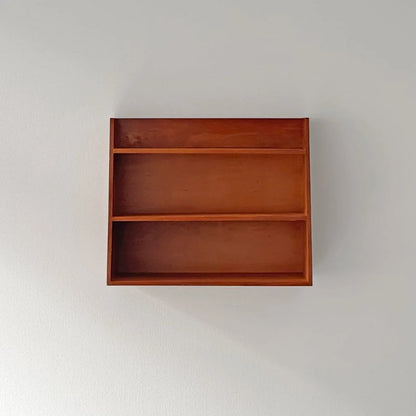 Straight-on studio shot of the empty Slanted Wood Wall Shelf against a white wall - RoomDen