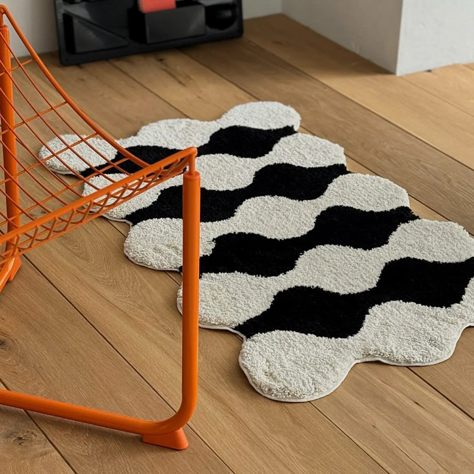 Wavy accent rug styled in a modern living space with mid-century cabinet - RoomDen