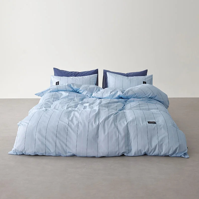 Full shot of the Sky Blue Pinstripe Washed Cotton Bedding Set, showcasing its lighter, airy color variant - RoomDen.