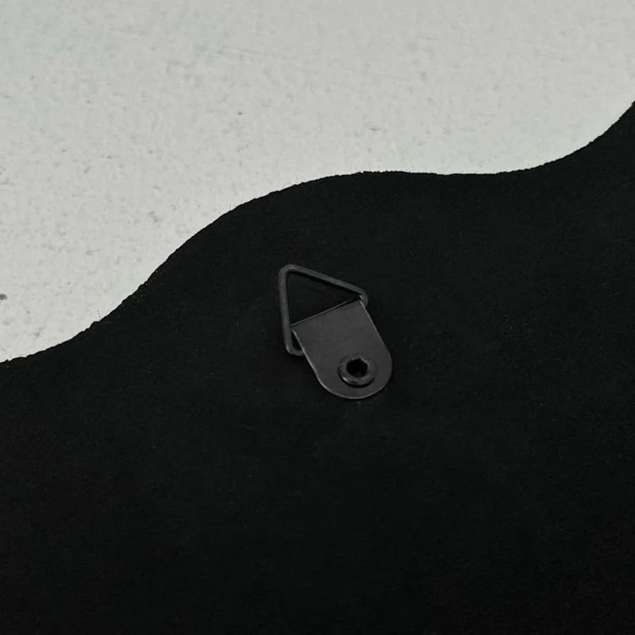 Close-up of the metal triangle hook on the back of the mirror for wall mounting - RoomDen