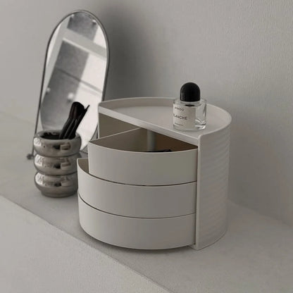 Three-quarter view of the swivel makeup organizer, with tiers partially opened. - RoomDen