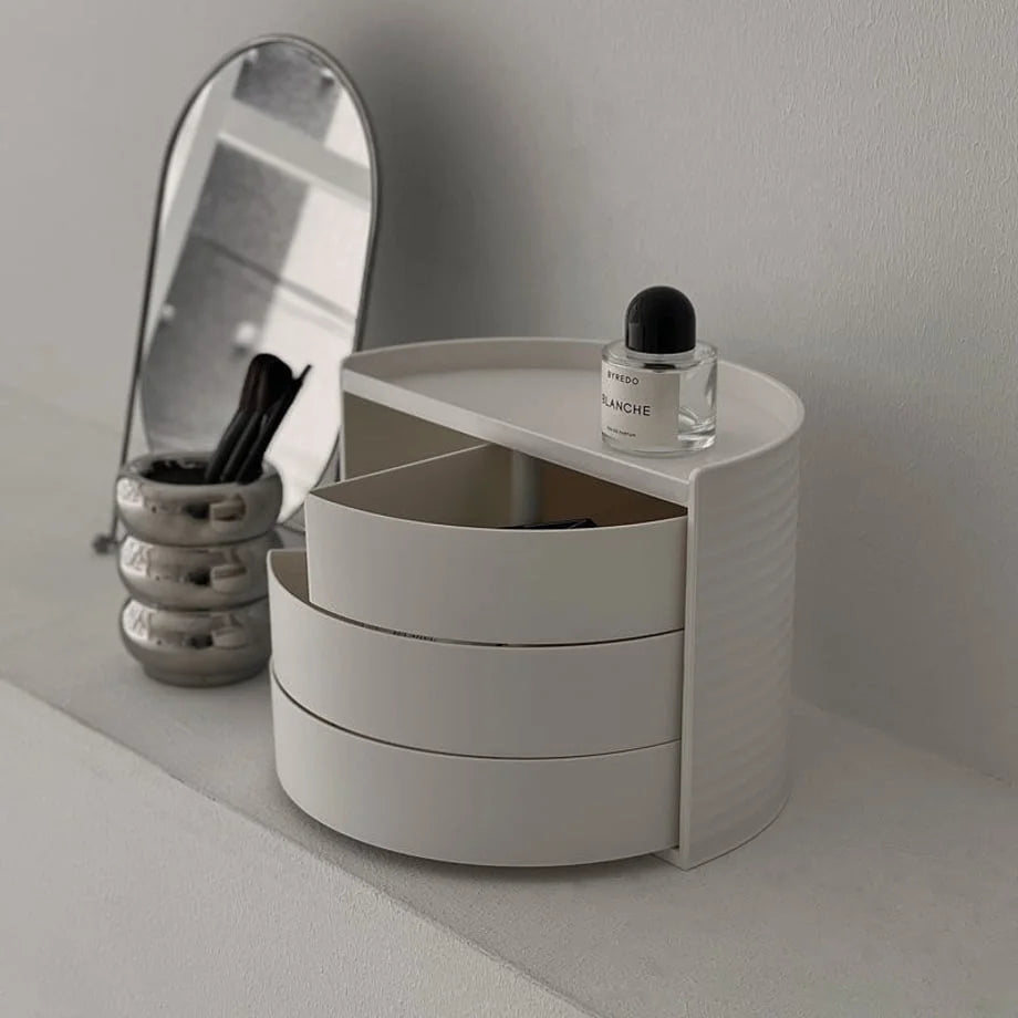 Three-quarter view of the swivel makeup organizer, with tiers partially opened. - RoomDen