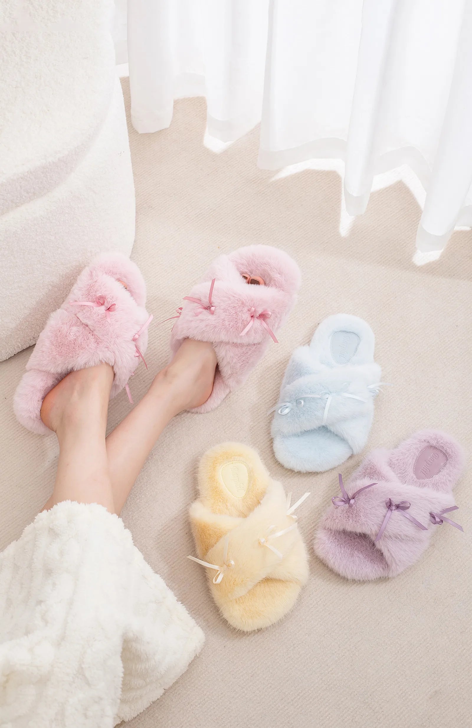Group collection of pink blue yellow and purple plush bow slippers - RoomDen