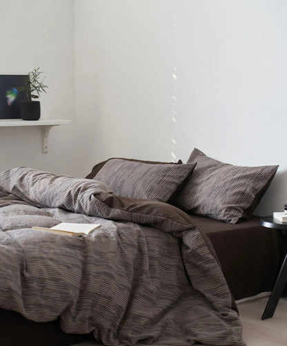 Lifestyle scene of the Mocha Brown bedding in a well-lit, serene bedroom setting.