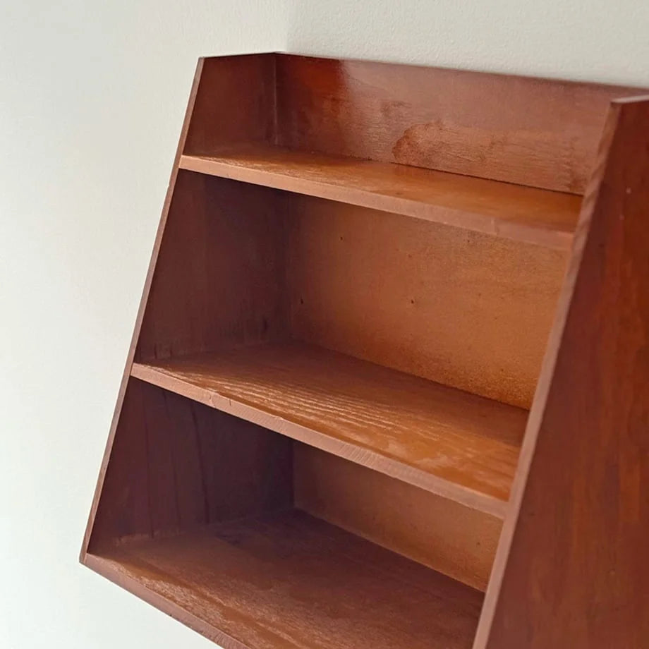 Detailed shot of the interior wood grain and construction of the wall shelf - RoomDen