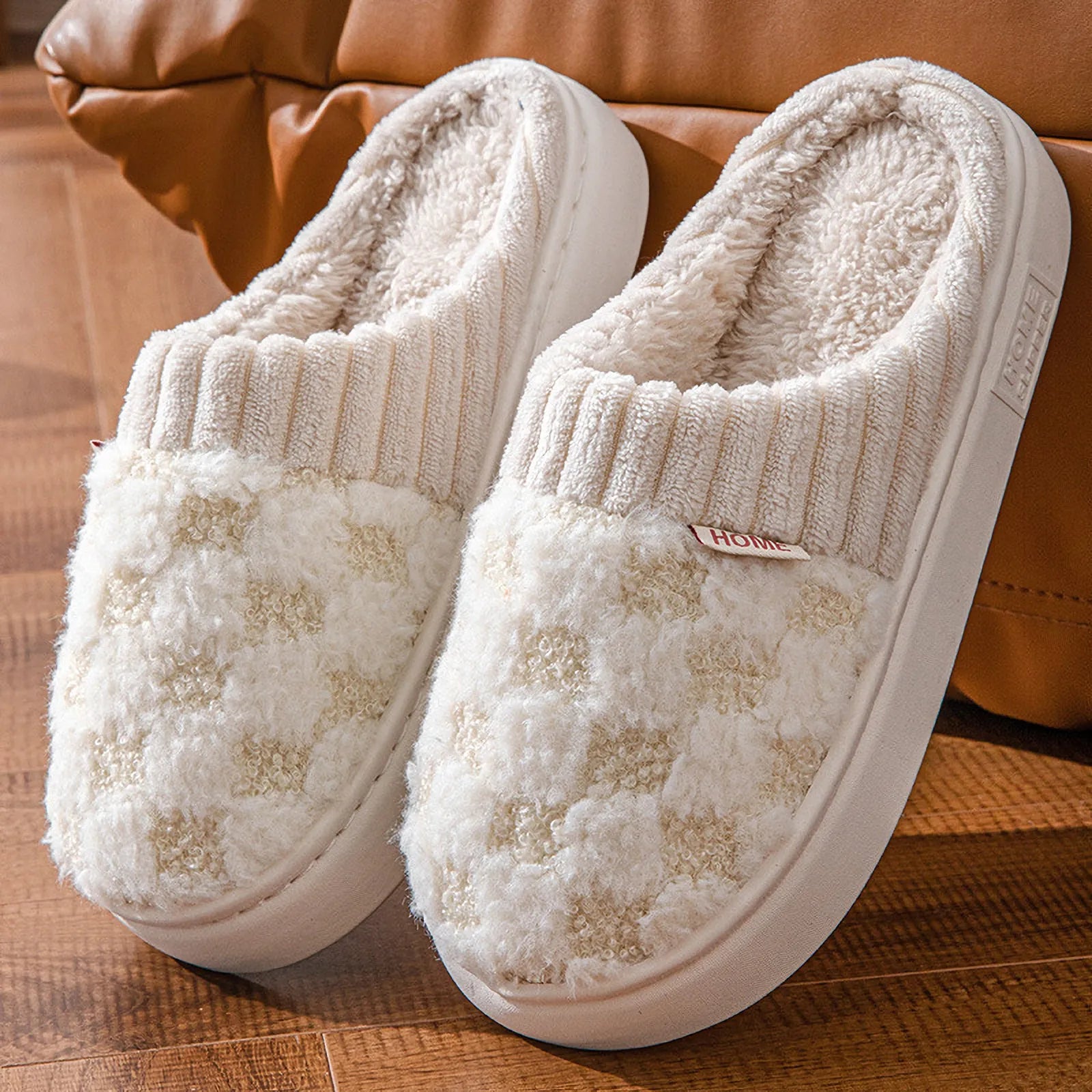 Close up of beige and white checkered plush house slippers - RoomDen