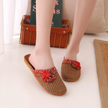 Front view of Red Floral Woven Slippers on model feet - RoomDen