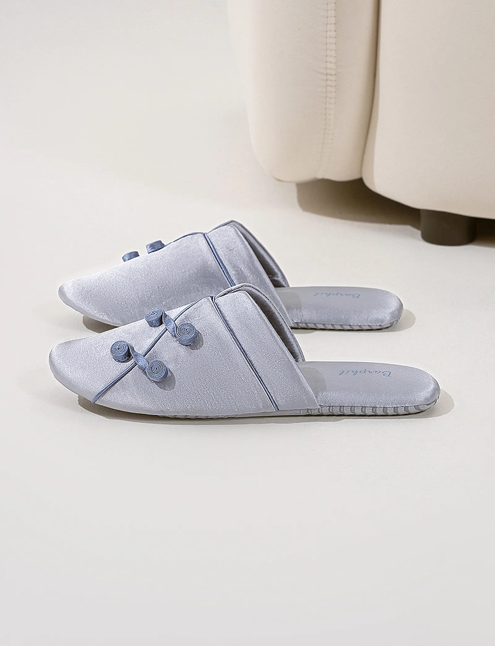 Model wearing Serenity Blue Silky Floral Knot slippers - RoomDen
