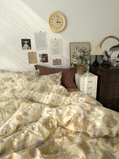 A cozy bed styled with the Soft Vintage Floral Cotton Bedding Set in a Light Academia-themed room with a wall clock and art prints. - RoomDen