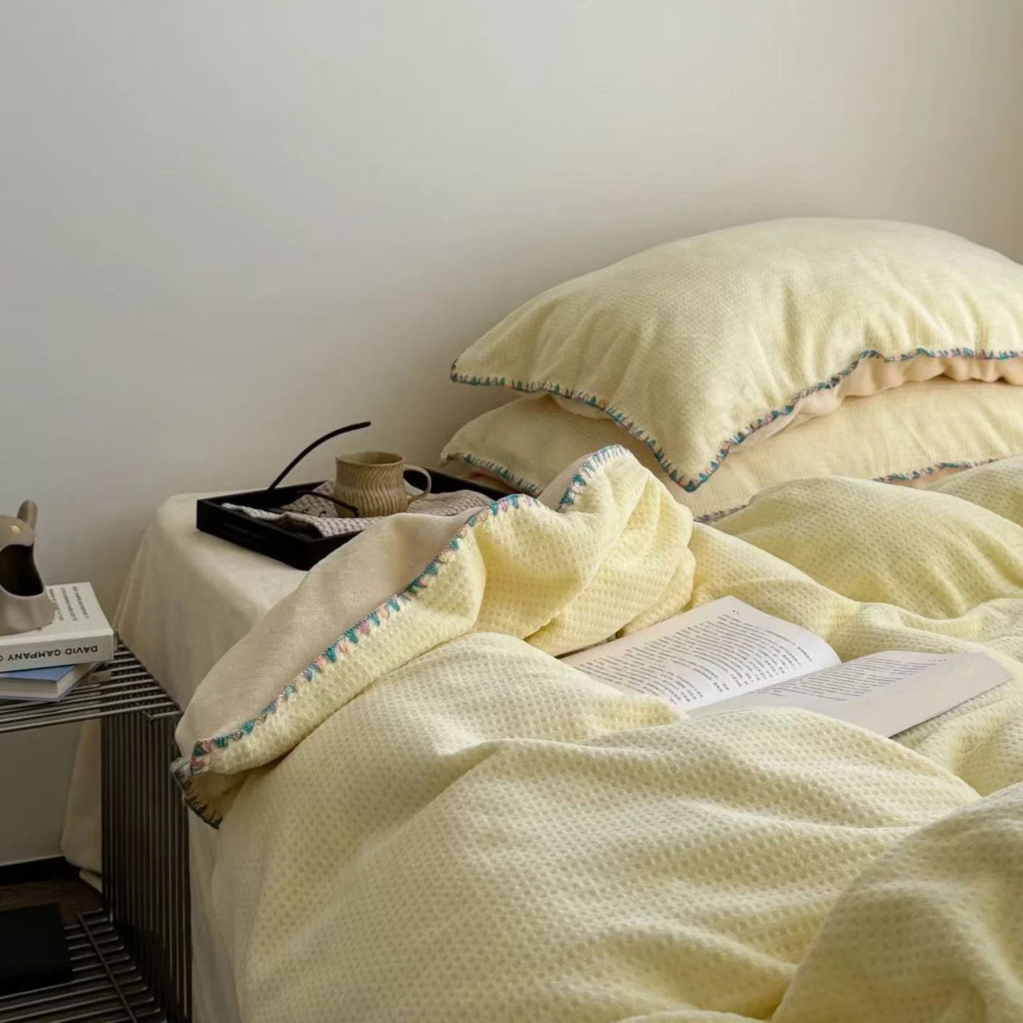 Lifestyle shot of the Butter Yellow Waffle Fleece Bedding Set, creating a warm and inviting bedroom scene.
