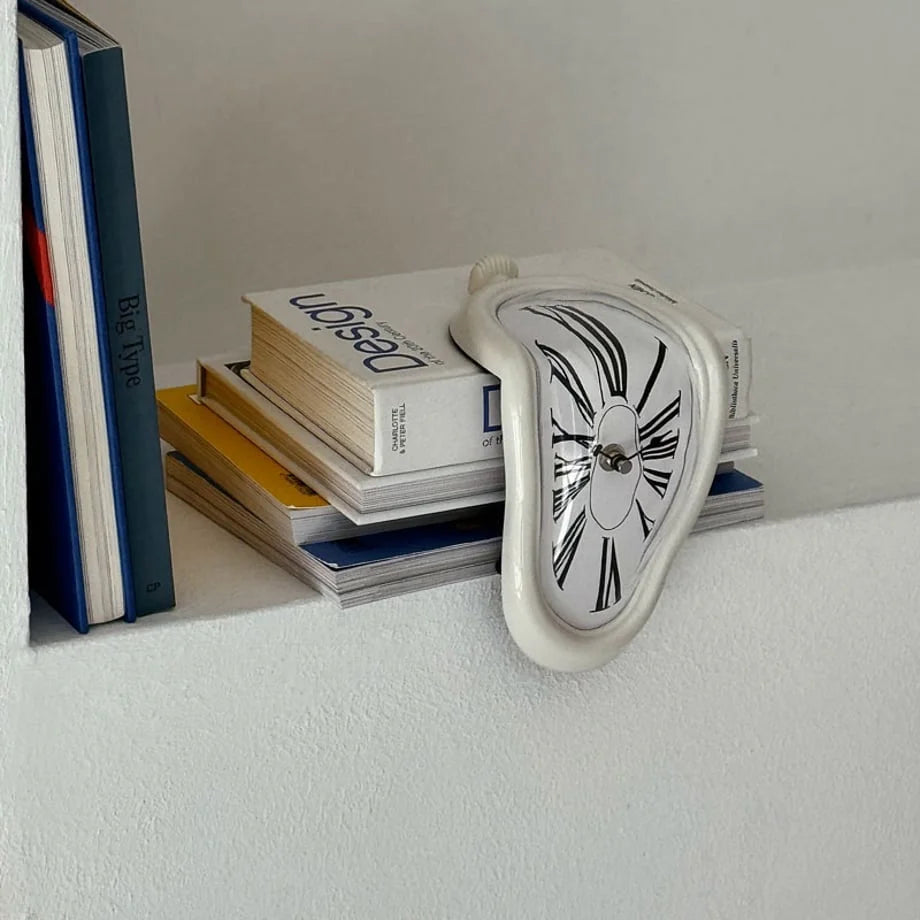 A different angle of the white melting clock on a stack of books. - RoomDen