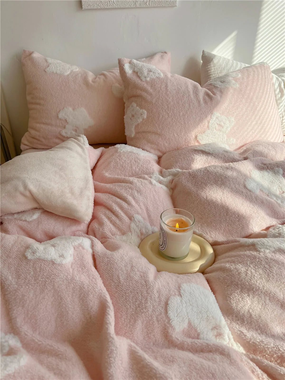 Close-up of the blush pink flannel fleece bedding set variant, showing the soft texture and white teddy bear pattern. - RoomDen
