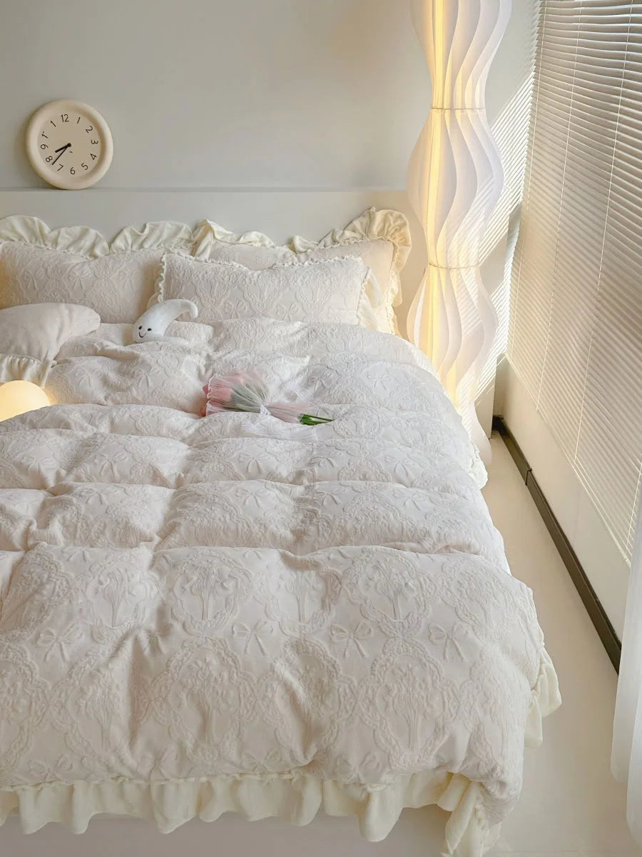 Angled view of the Creamy Beige Flannel Fleece Bedding Set showing the ruffle trim and textured surface, next to a modern floor lamp - RoomDen.