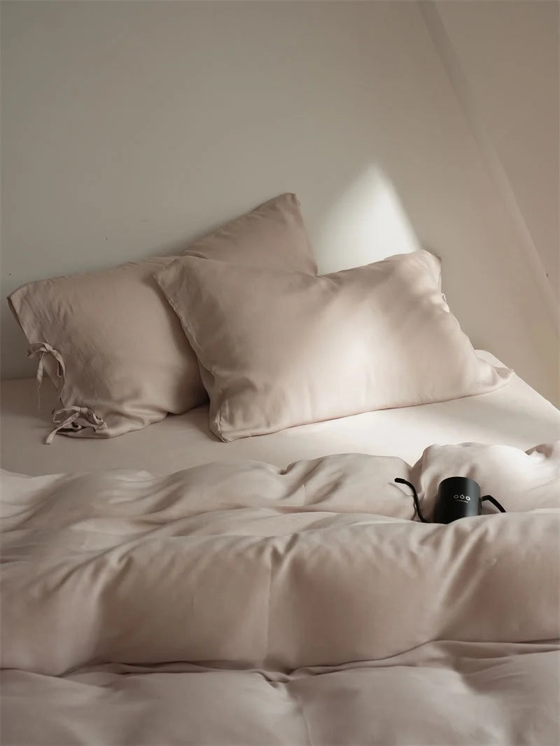 Softly lit shot of the Dusty Rose Tencel Bedding Set, emphasizing its cozy and inviting texture - RoomDen