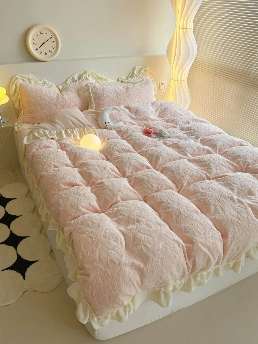 Angled shot of the Pastel Pink Ruffled Bedding Set, highlighting its volume and soft drape on the bed - RoomDen.