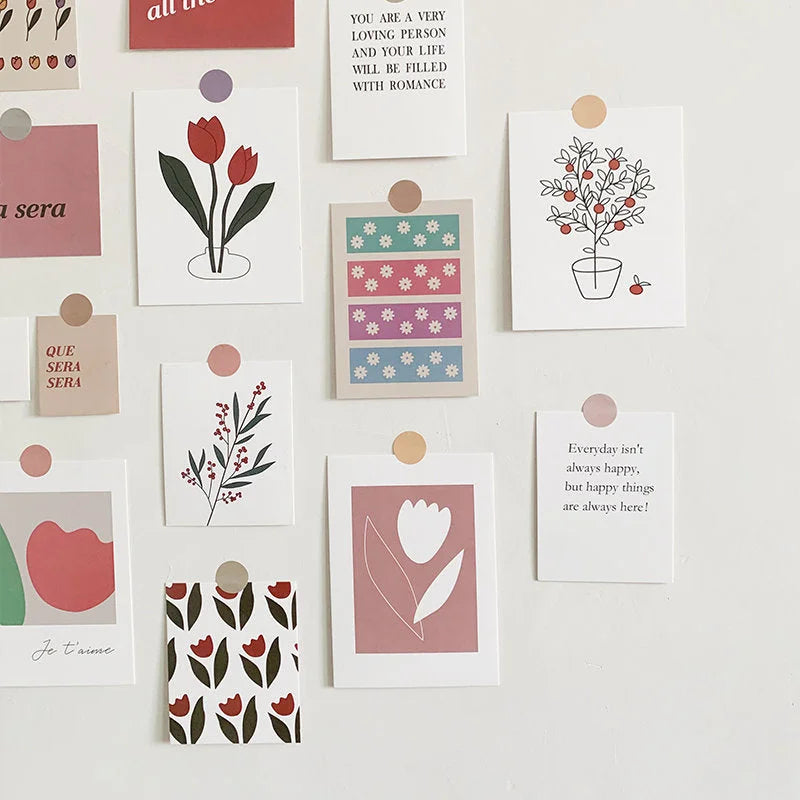 Close-up detail of several cards from the vintage floral wall collage kit, including tulips and quotes. - RoomDen