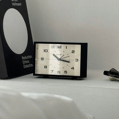 Detailed close-up of the Matte Black Retro Table Clock's face.