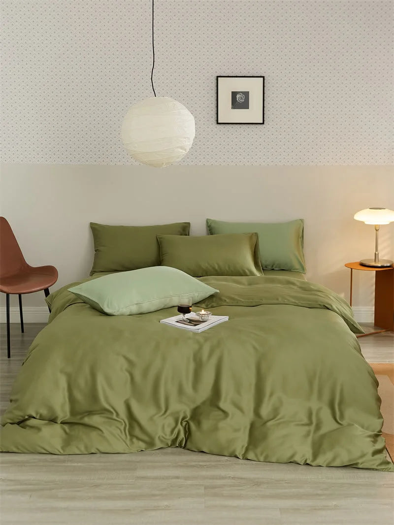 Full view of the olive green Tencel bedding set in a minimalist bedroom with a paper lantern and modern side chair - RoomDen.