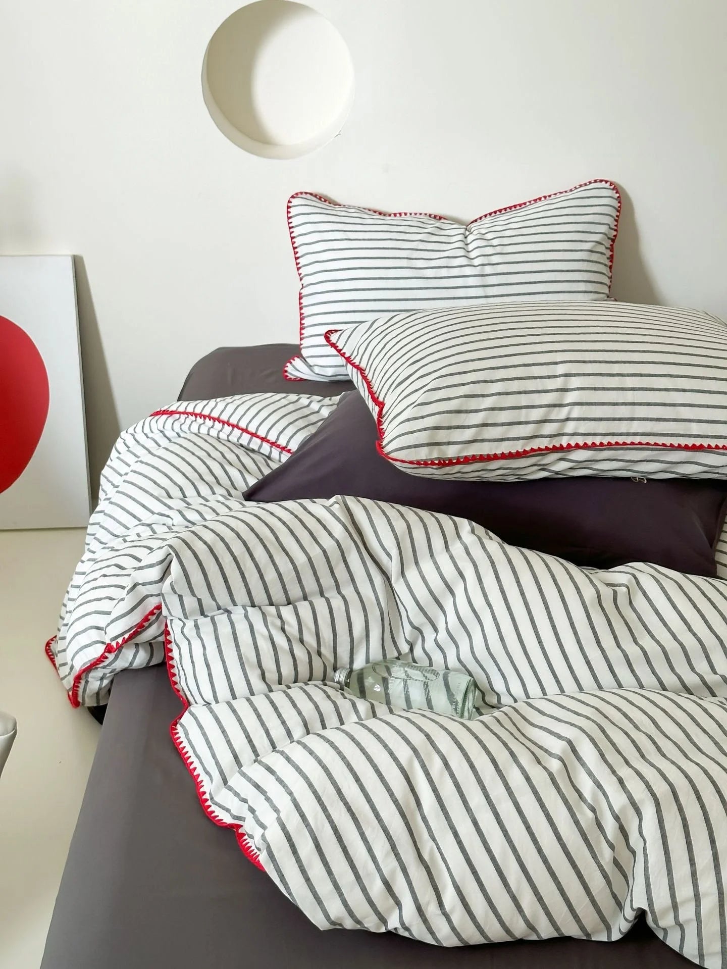 Full View of Black Striped Bedding Set in Minimalist Bedroom - RoomDen