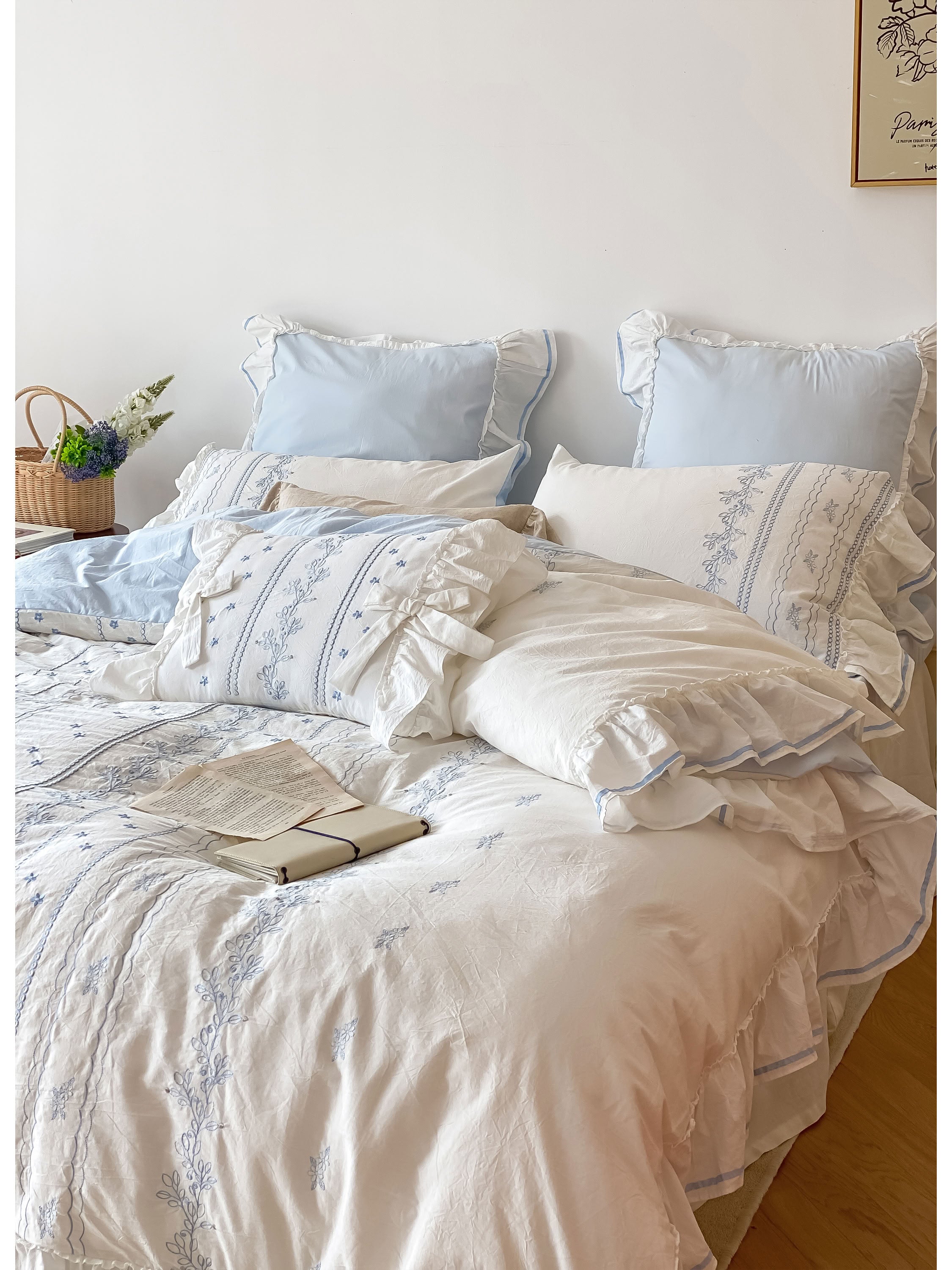 Light blue bedding set featuring cottage-style embroidery, layered ruffle trim, and soft cotton texture - RoomDen