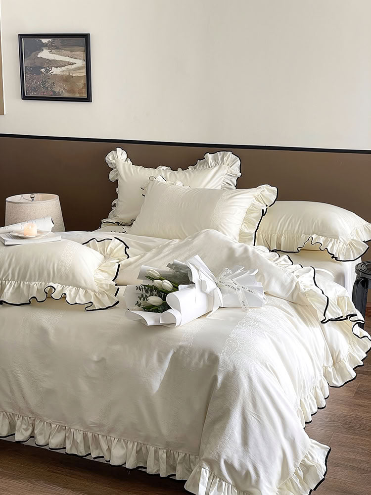 Ivory French ruffled Tencel bedding set with black piping and frilled edges - RoomDen
