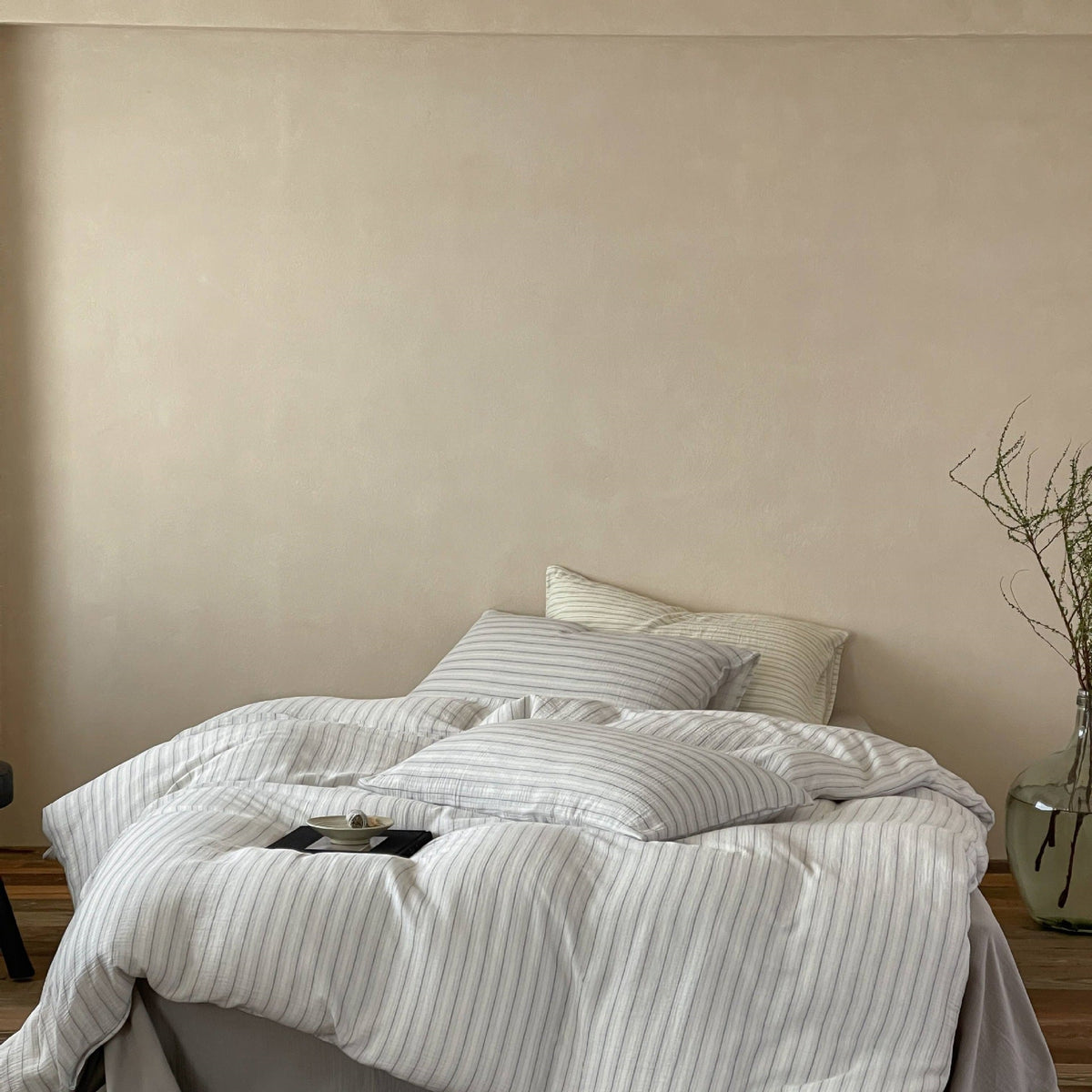 Halden Striped Cotton Double Gauze Bedding Set – fog grey striped bedding in a simply furnished room - Roomden