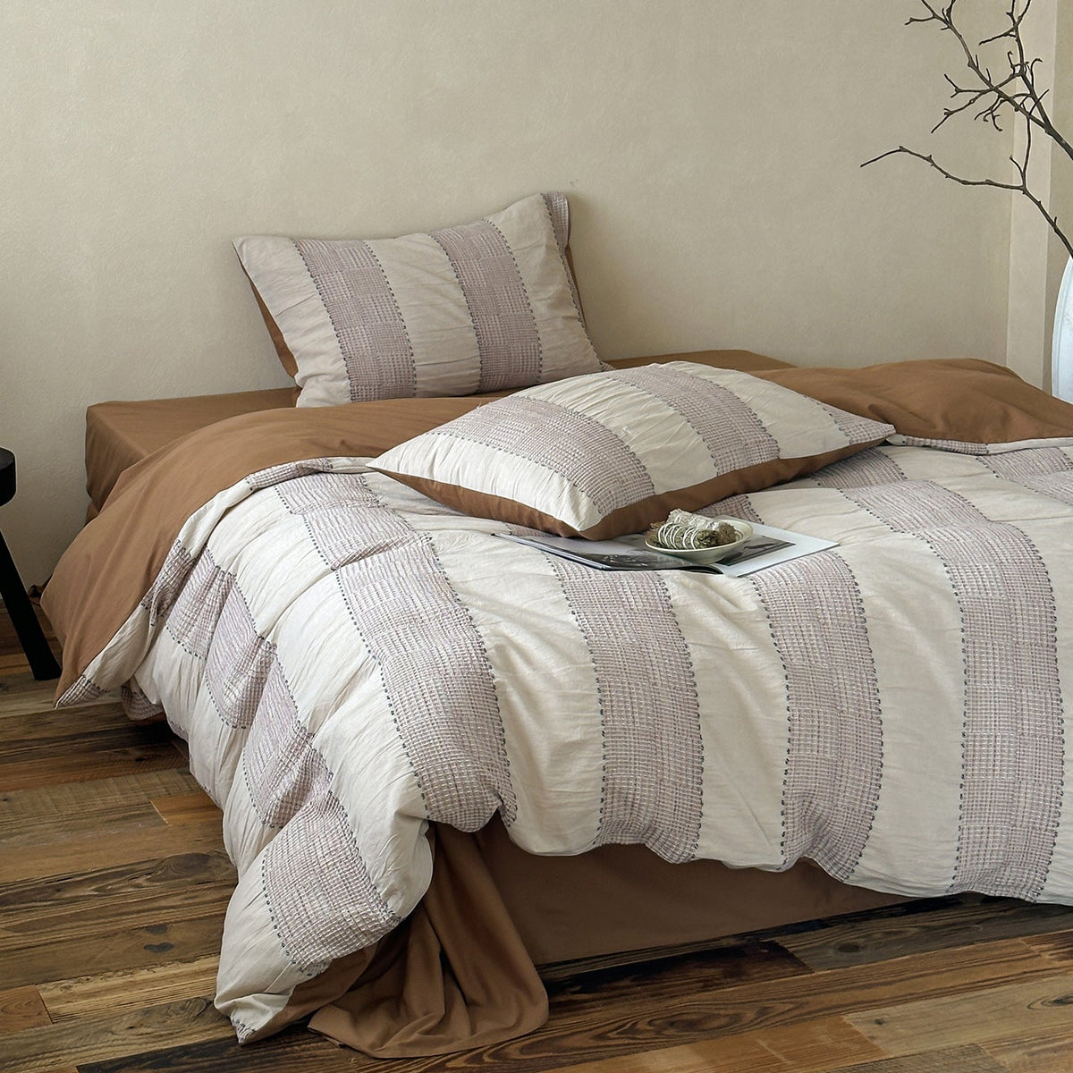 Solmere Striped Waffle-Weave Cotton Bedding Set – khaki stripe full bed arranged beside a tall vase - Roomden