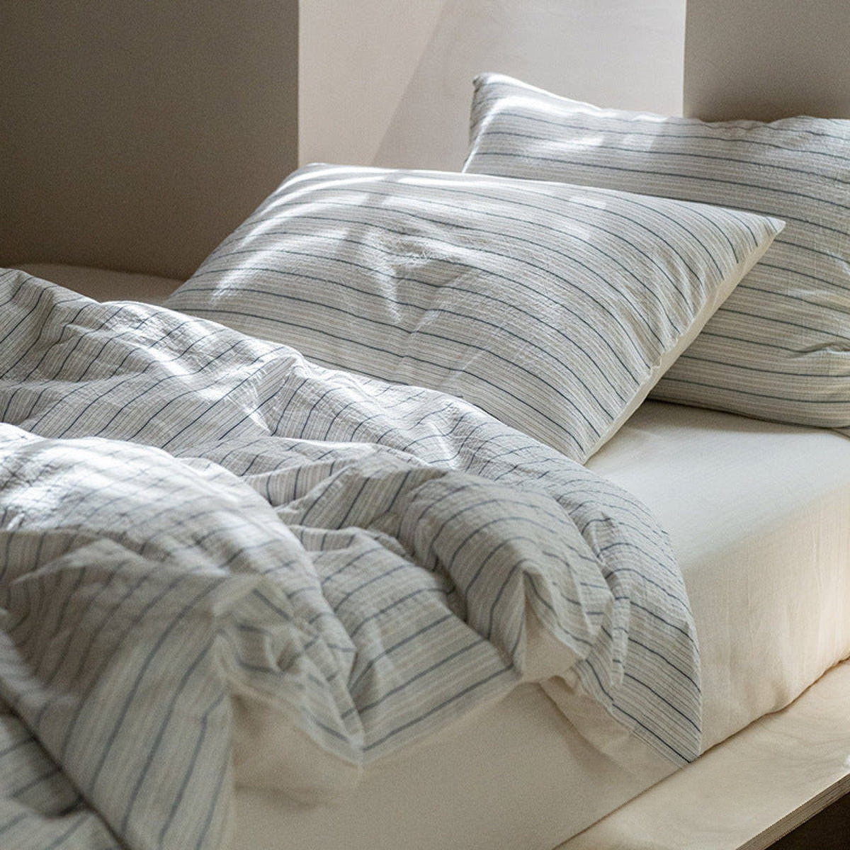 Winslet Pinstripe Cotton Bedding Set – close view of fine grey stripes and cotton texture - Roomden