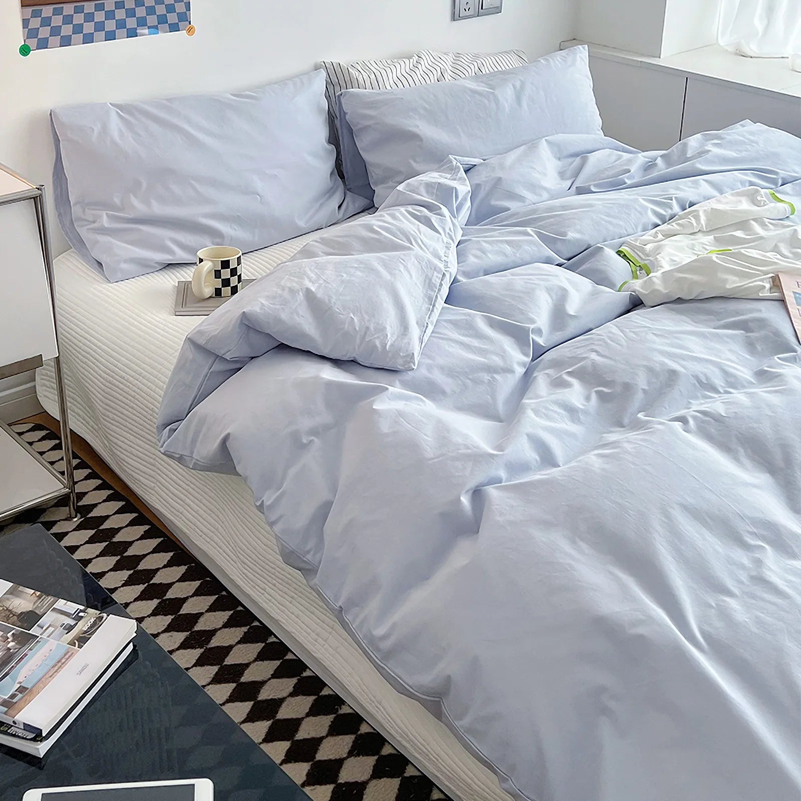Soft pastel solid washed cotton duvet cover and pillowcases in a cozy minimalist bedroom – RoomDen