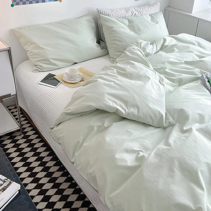 Soft pastel solid washed cotton duvet cover and pillowcases in a cozy minimalist bedroom – RoomDen