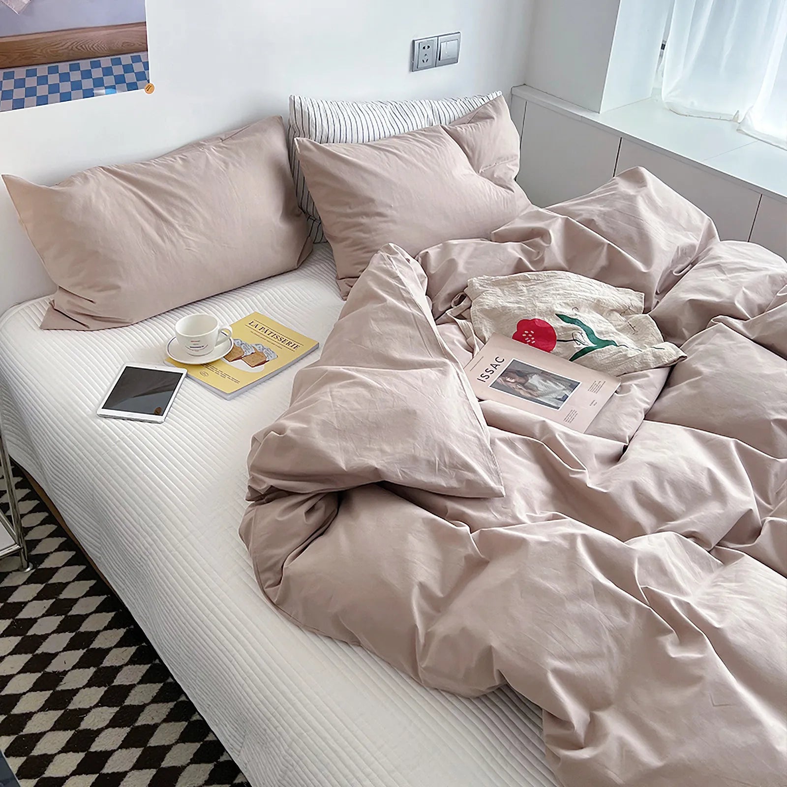 Soft pastel solid washed cotton duvet cover and pillowcases in a cozy minimalist bedroom – RoomDen