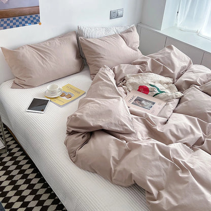 Soft pastel solid washed cotton duvet cover and pillowcases in a cozy minimalist bedroom – RoomDen