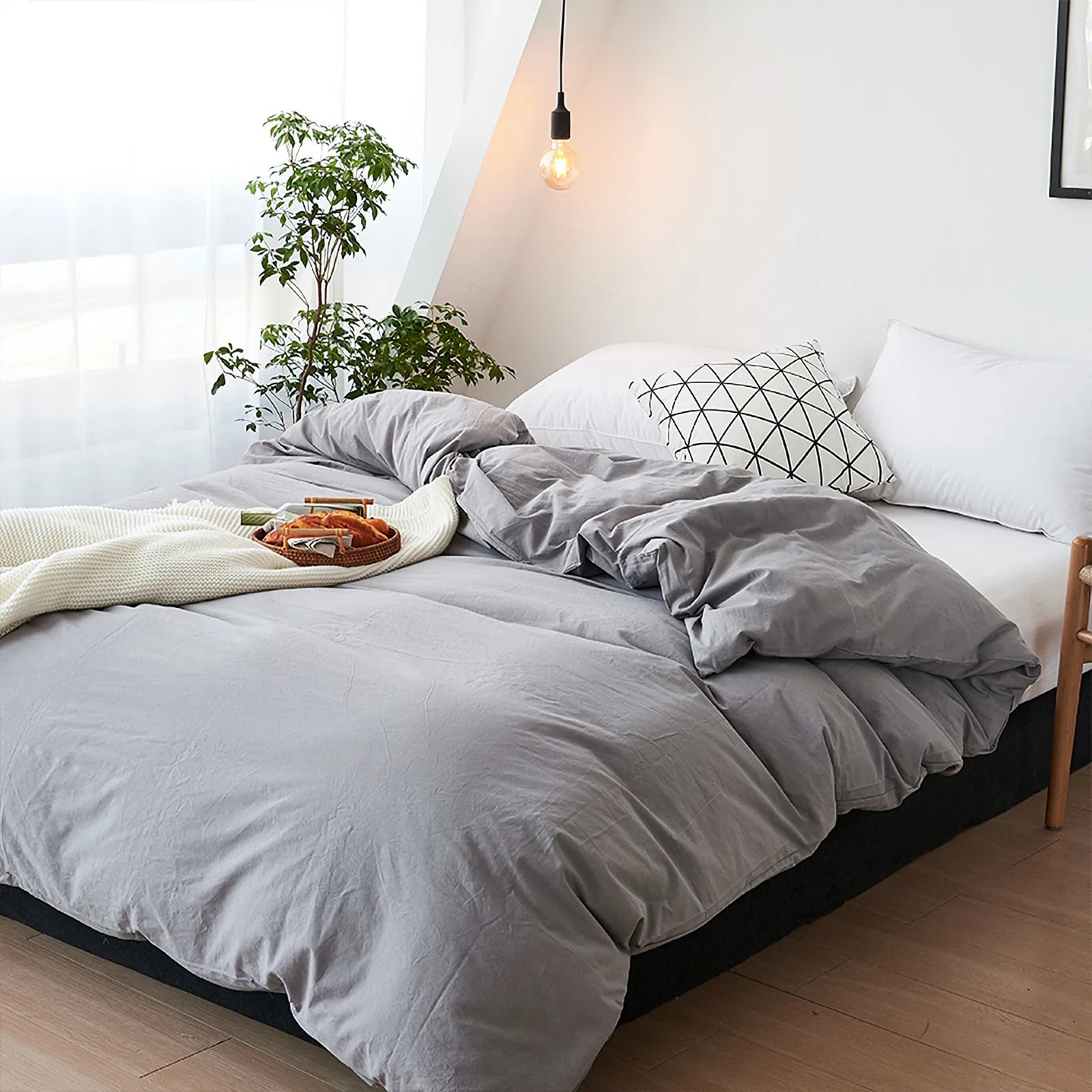 Soft pastel solid washed cotton duvet cover and pillowcases in a cozy minimalist bedroom – RoomDen