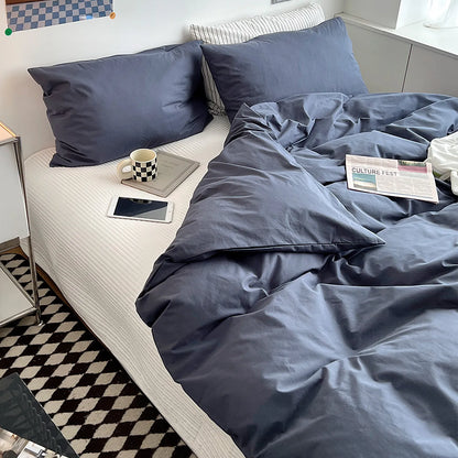 Soft pastel solid washed cotton duvet cover and pillowcases in a cozy minimalist bedroom – RoomDen