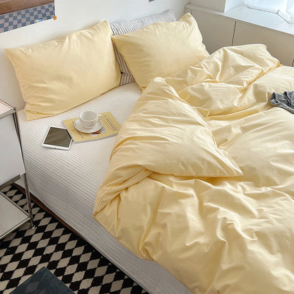 Soft pastel solid washed cotton duvet cover and pillowcases in a cozy minimalist bedroom – RoomDen