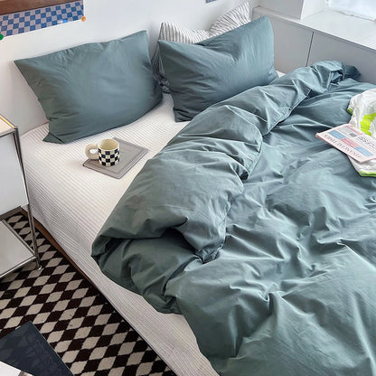 Soft pastel solid washed cotton duvet cover and pillowcases in a cozy minimalist bedroom – RoomDen