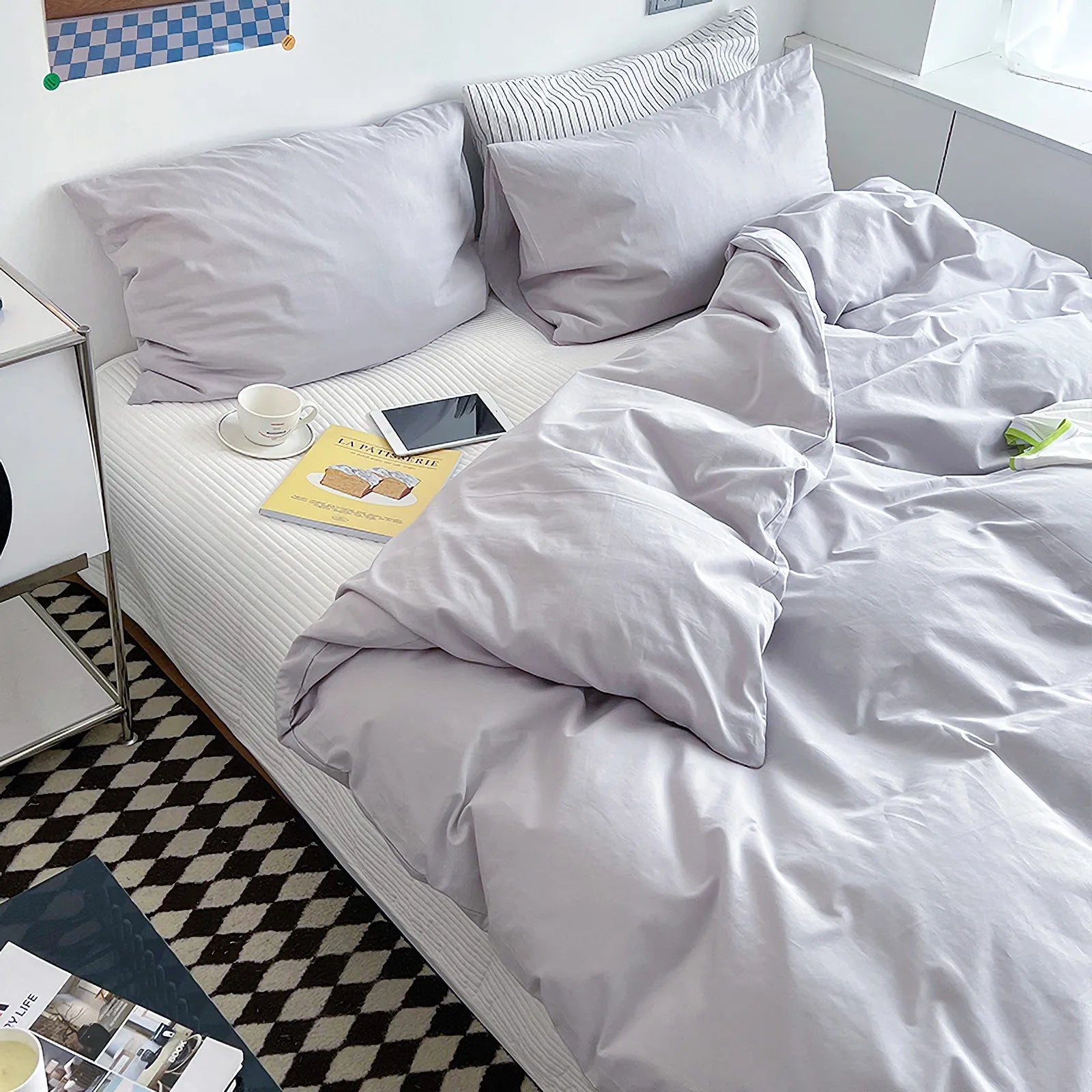Soft pastel solid washed cotton duvet cover and pillowcases in a cozy minimalist bedroom – RoomDen