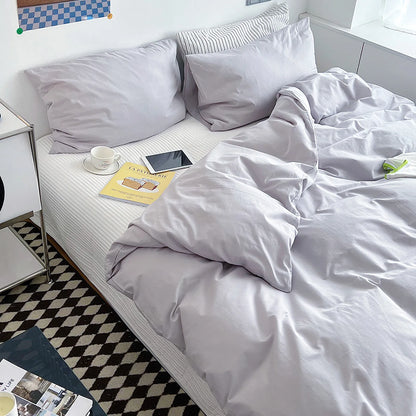 Soft pastel solid washed cotton duvet cover and pillowcases in a cozy minimalist bedroom – RoomDen