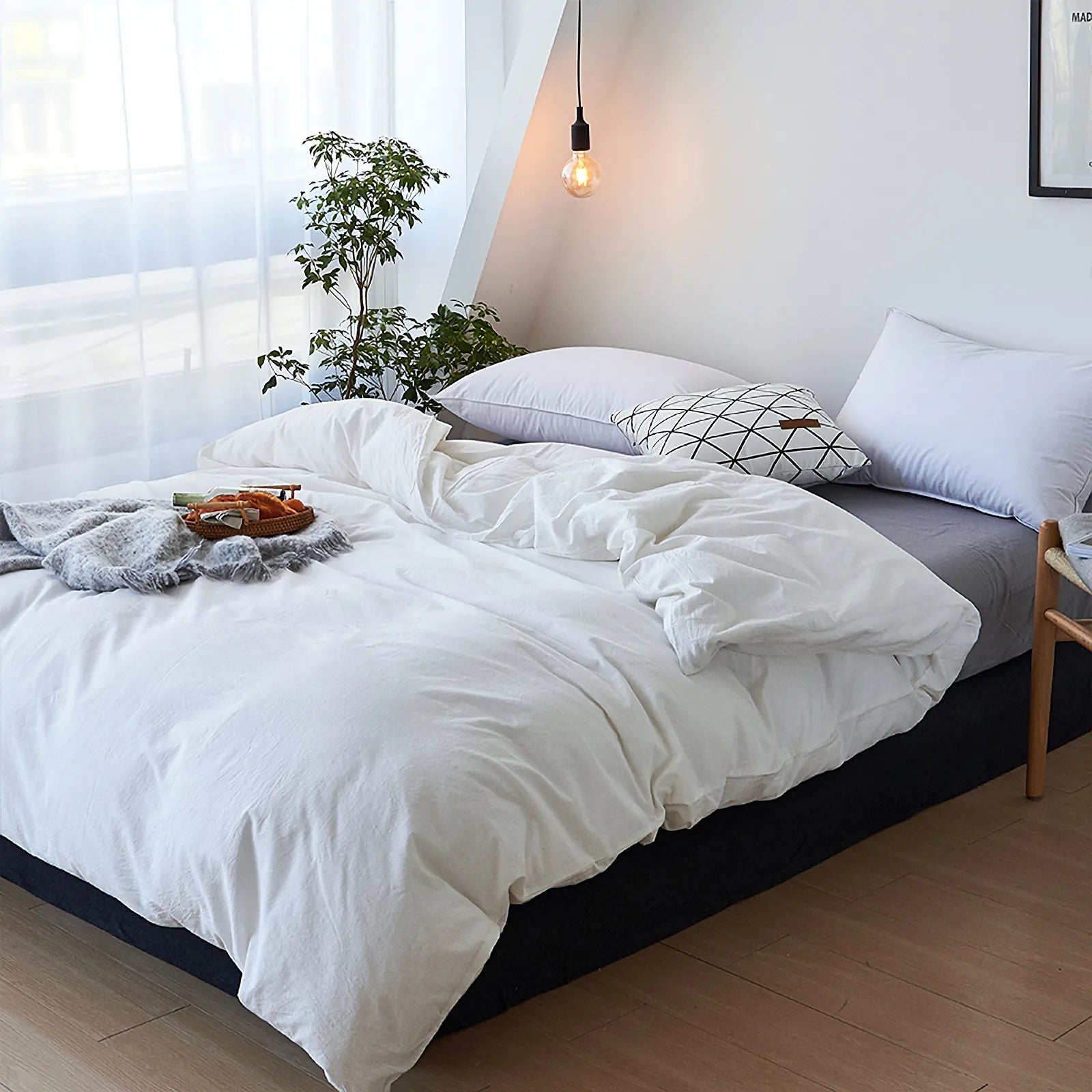 Soft pastel solid washed cotton duvet cover and pillowcases in a cozy minimalist bedroom – RoomDen